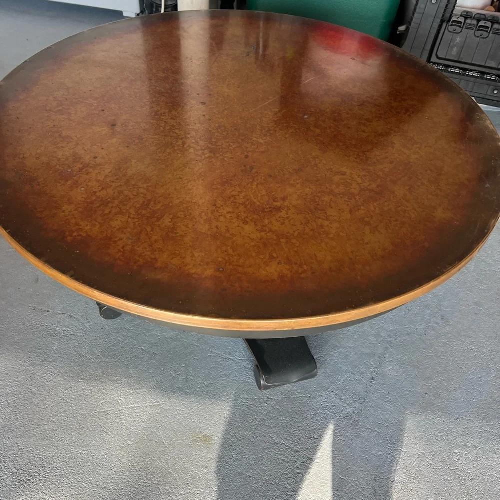 Crate and Barrel 36” Round Copper Coffee Table. Pedestal base